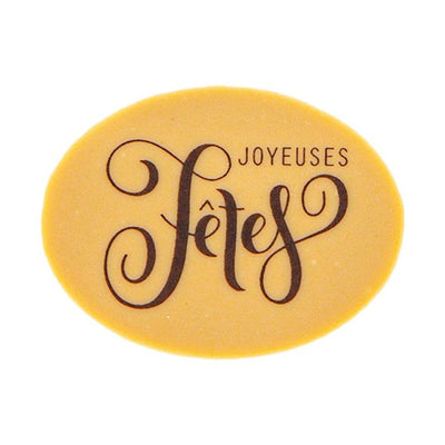 Décor en chocolat Dulcey ovale “Joyeuses Fêtes” – impression naturelle sur chocolat blond Valrhona