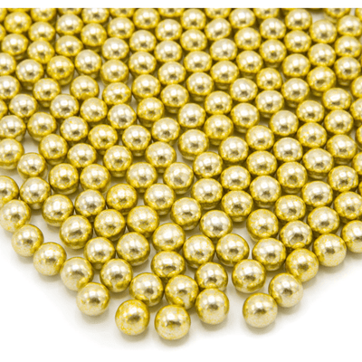 Vue en gros plan des boules dorées comestibles de taille moyenne Happy Sprinkles